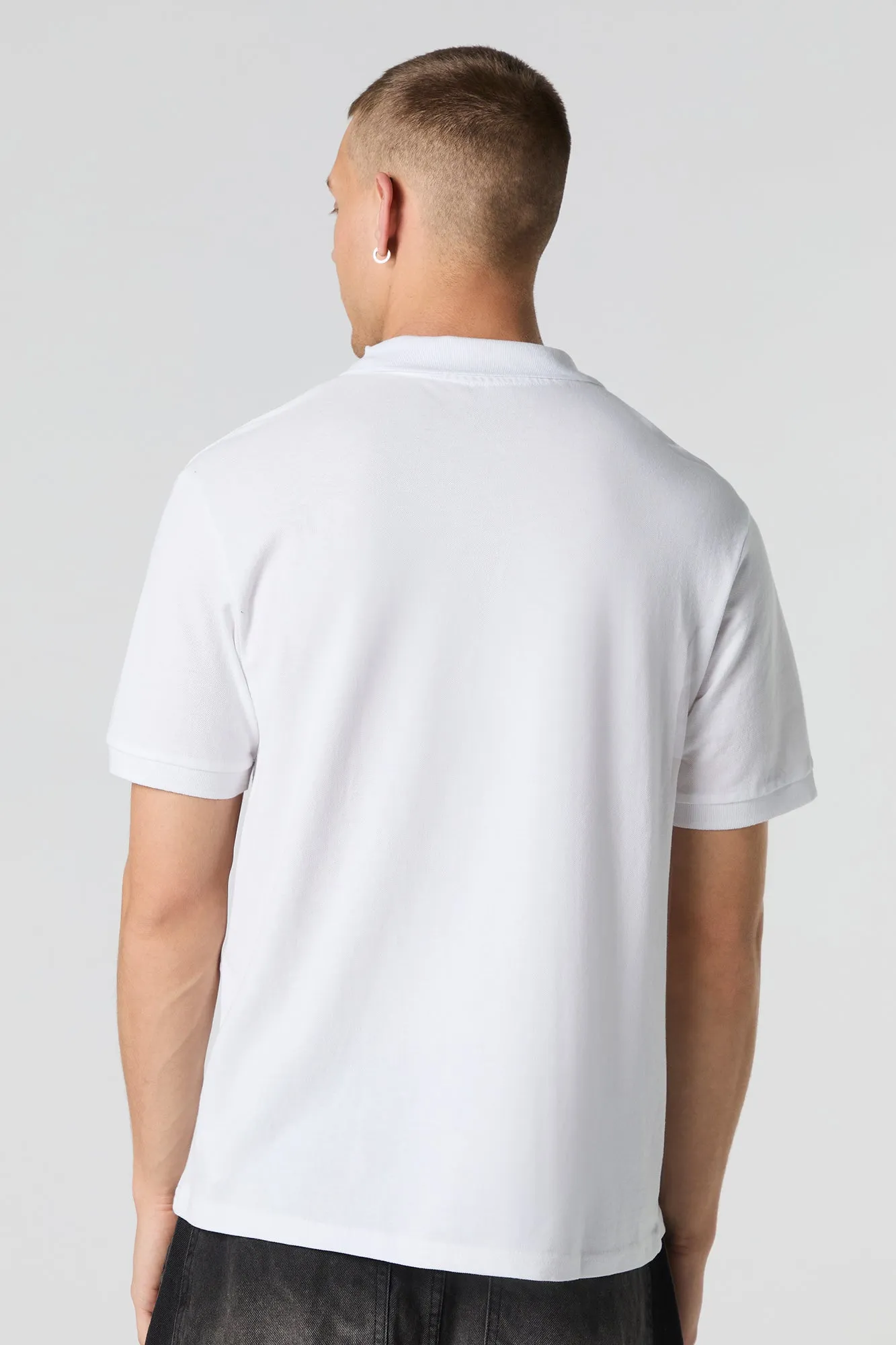 Polo rayé à motif géométrique