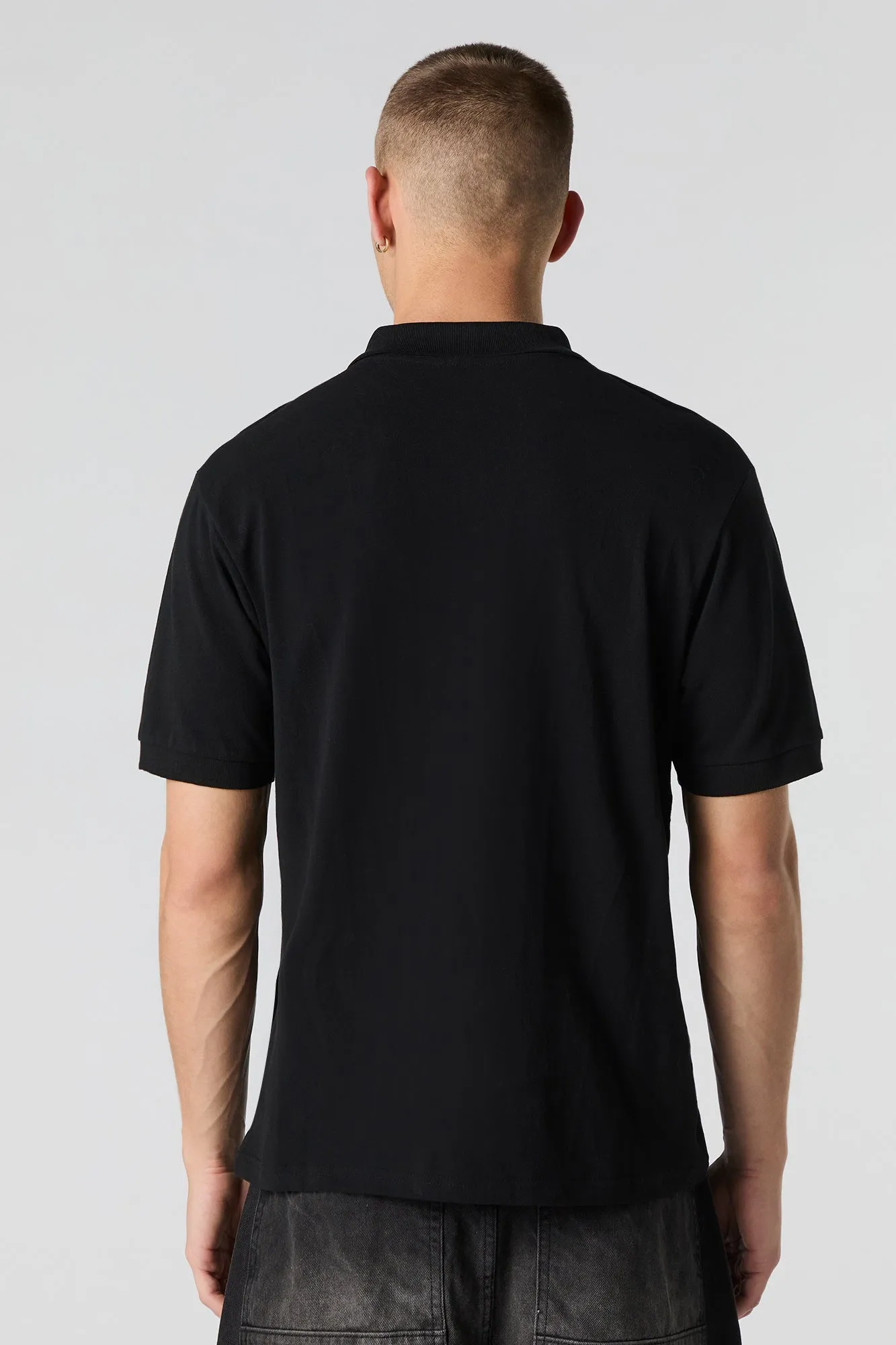 Polo rayé à motif géométrique